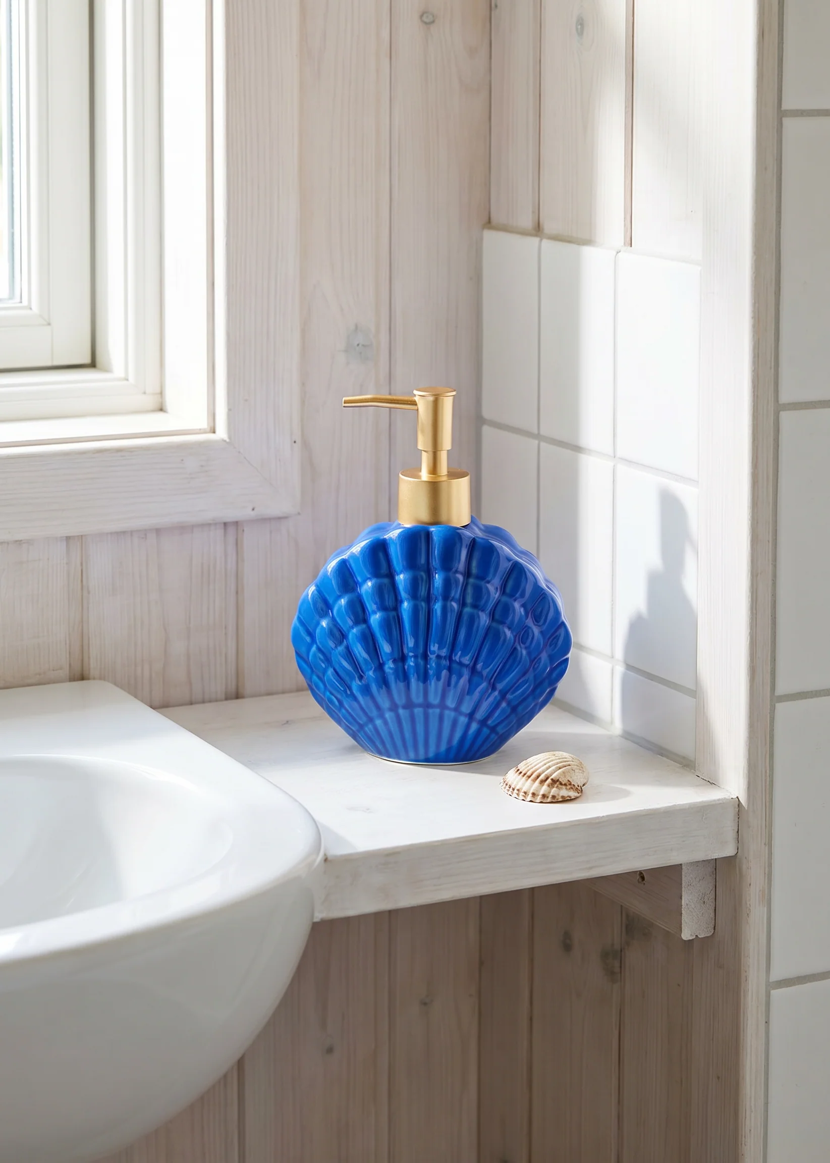 Blue ceramic seashell soap dispenser